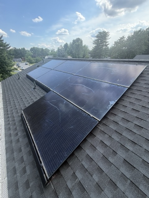 Close-up of solar panel array on a shingle roof