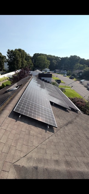 Rooftop solar array with neighborhood view